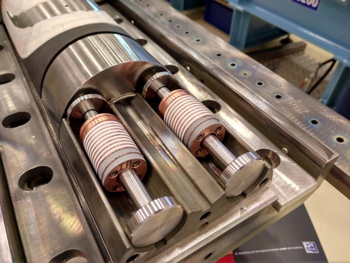 Control samples fitted to the ends of the niobium–tin coils’ heat-treatment mould to check the conformity of the electrical performance