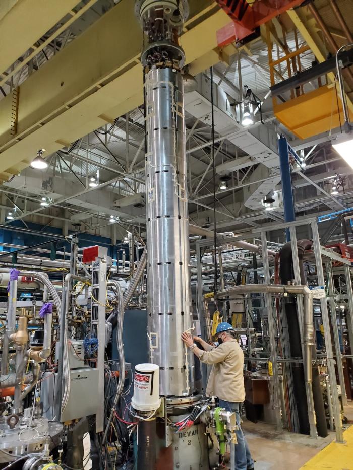 The MQXFA05 magnet enters the vertical cryostat at the Brookhaven National Laboratory for its endurance test (Image: BNL)