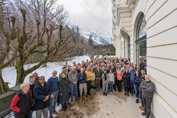 group photo with white mountains in the background